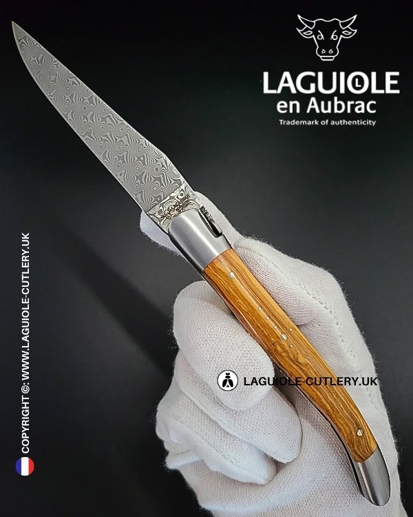 laguiole pocket knife in olivewood with damascus blade & hand engraved plates