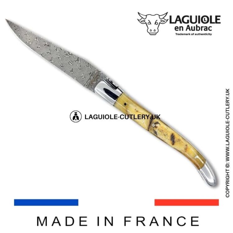 laguiole pocket knife in ram horn with damascus blade & hand engraved plates