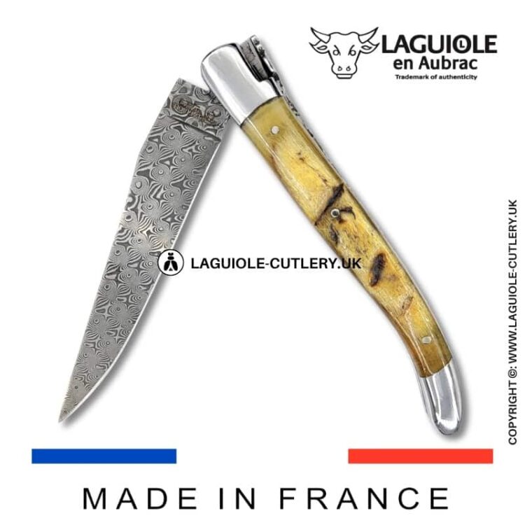 laguiole pocket knife in ram horn with damascus blade & hand engraved plates