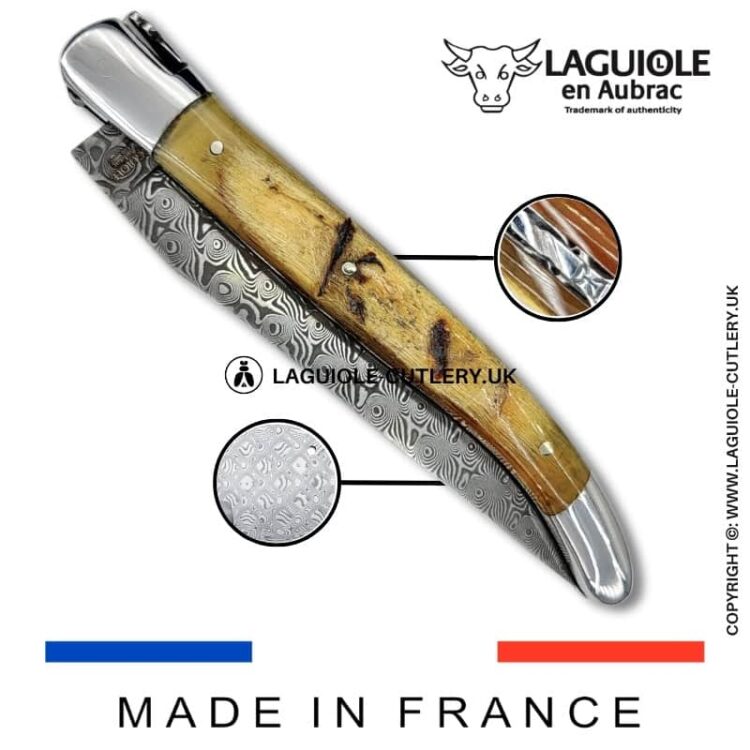 laguiole pocket knife in ram horn with damascus blade & hand engraved plates