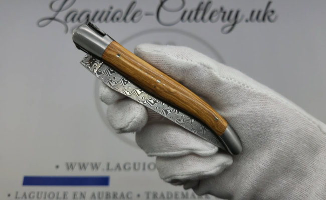 laguiole pocket knife in olivewood with damascus blade & hand engraved plates